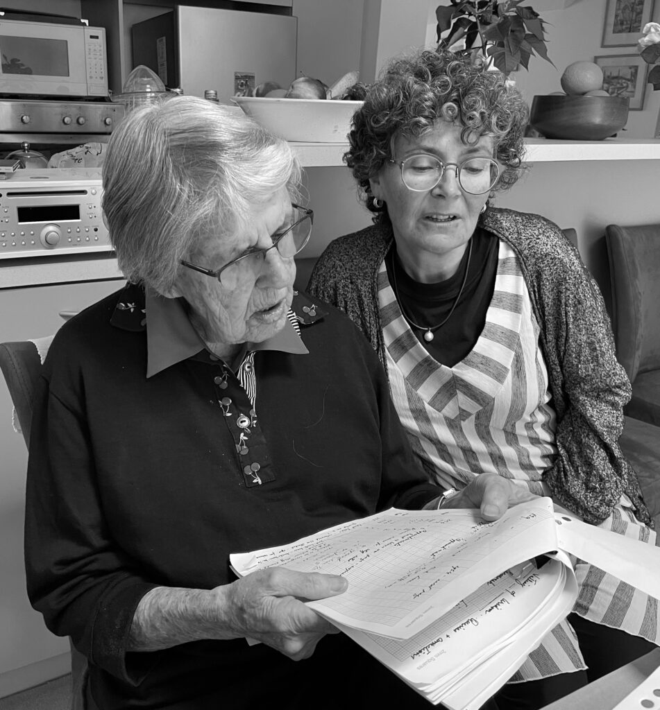 Joan Montgomery, left, with Kim Rubenstein as they review historical material for the book.