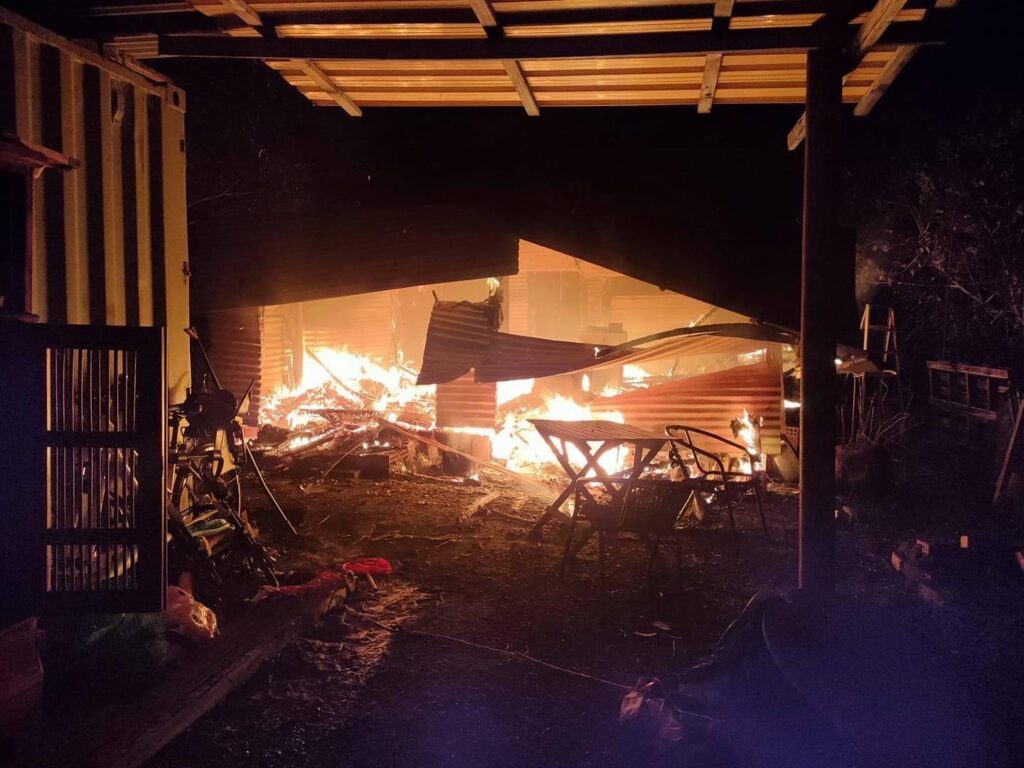 Lauren says: "This photo shows the house on fire. I took this photo while searching for the cat and answering detectives' questions." Picture: Supplied