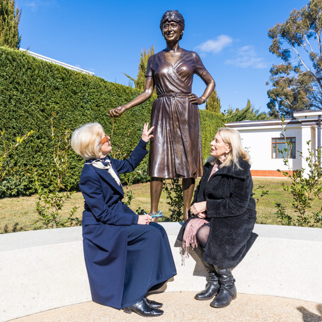 Dame Quentin Bryce (Left) sits with Dr Anne Summers (right) at the base of the Susan Ryan Sculpture, created by artist Lis Johnson. Picture: Michael Jackson-Rand